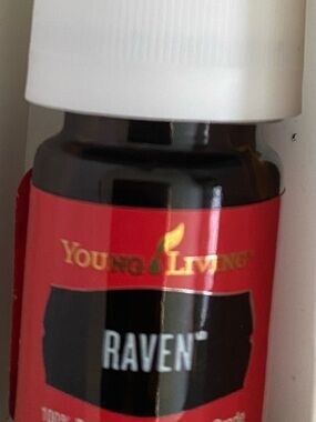 Young Living Essential Oil Bottle with Red and Black Label